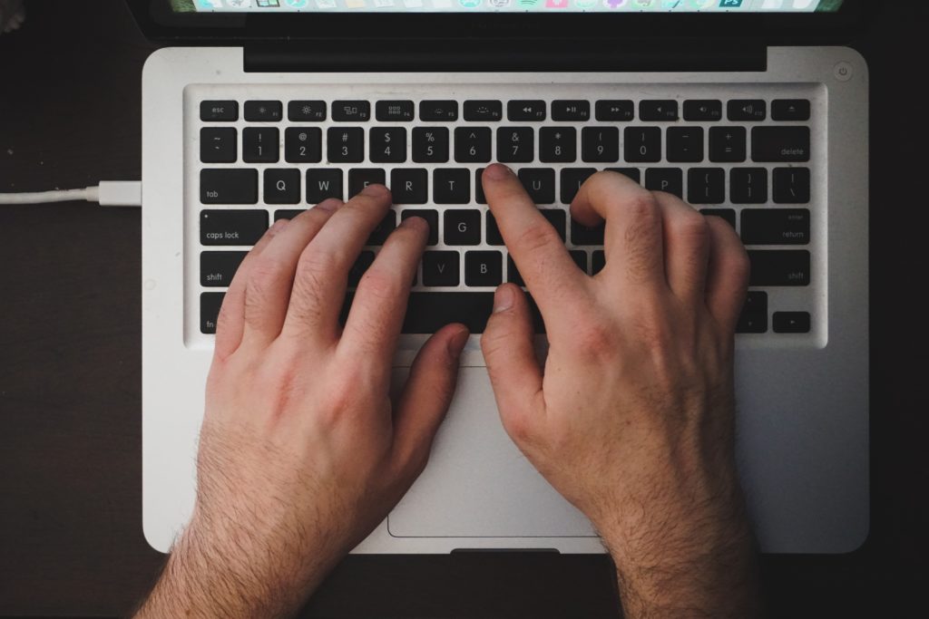 White hands on computer keyboard