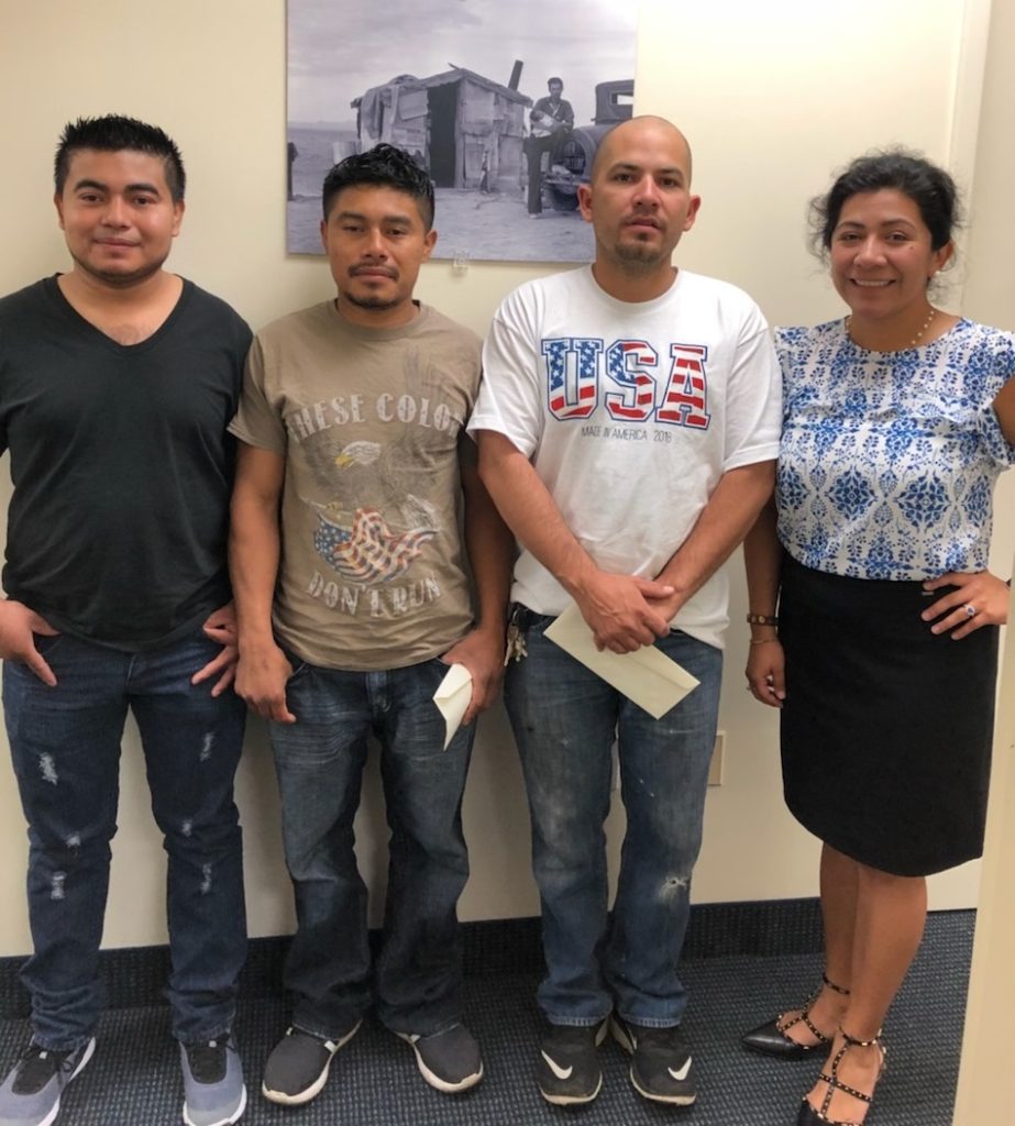 Three workers and PJC attorney Sulma Guzmán