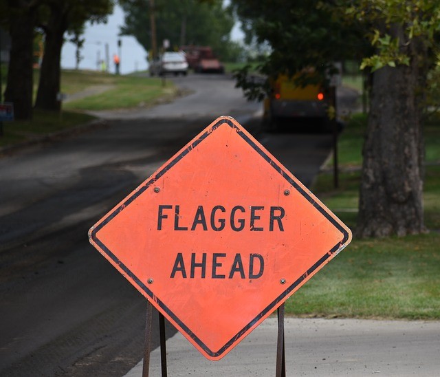 Flagger traffic sign